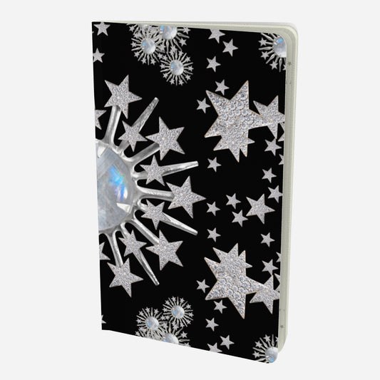 front cover of small notebook with celestial moonstone and stars design on a black background