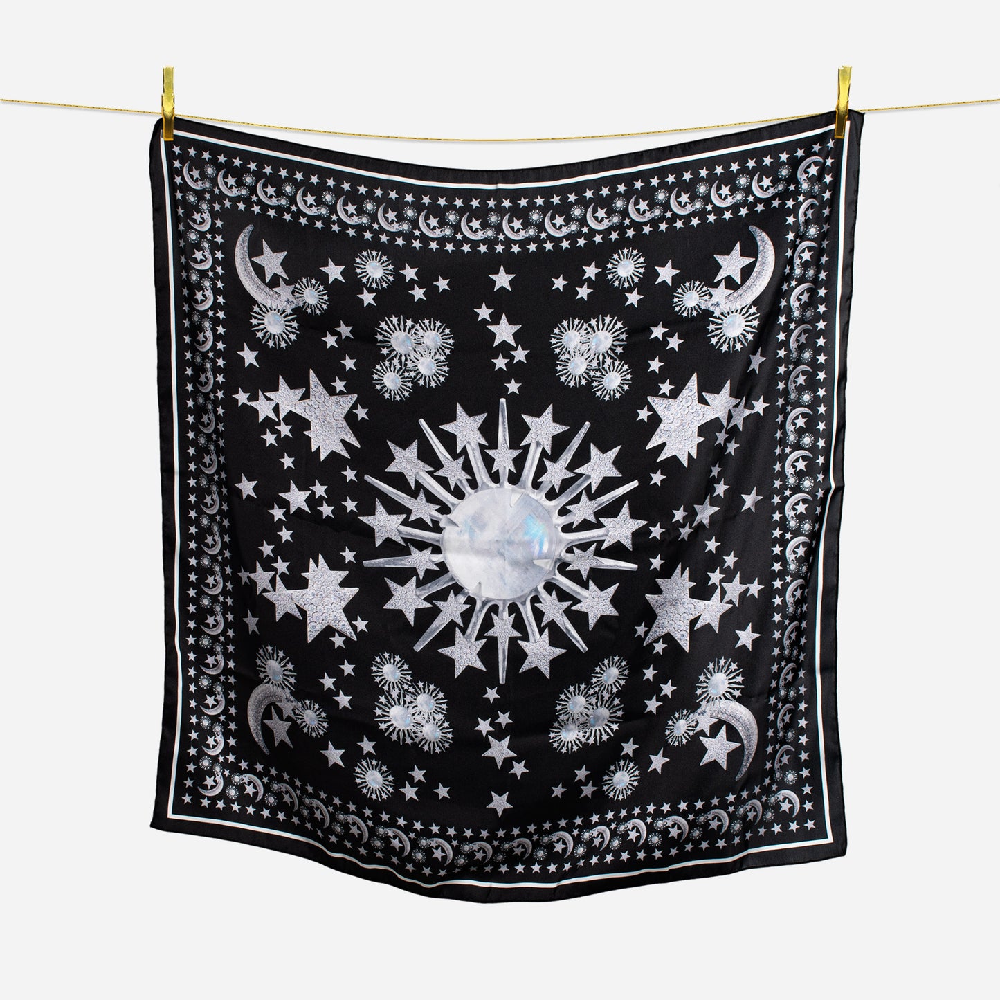 celestial moonstone and stars black scarf hanging on wire with gold pins
