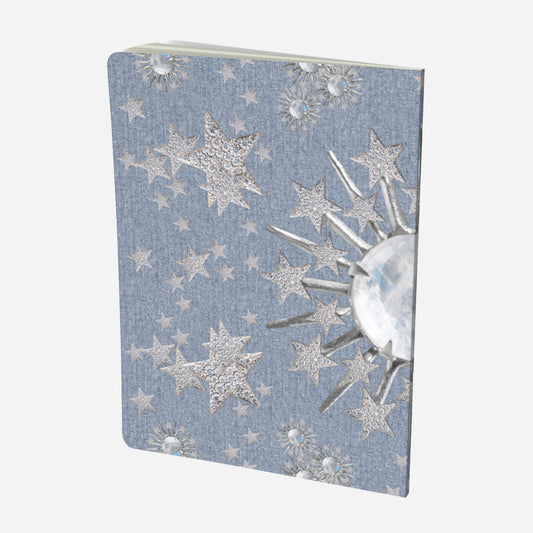 back cover of large notebook with celestial moonstone and stars design on a chambray denim look background