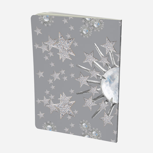 back cover of large notebook with celestial moonstone and stars design on a grey background