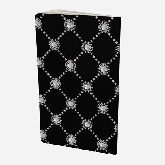 back cover of small notebook with celestial moonstone and stars lattice design on a black background