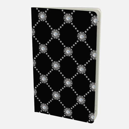 front cover of small notebook with celestial moonstone and stars lattice design on a black background