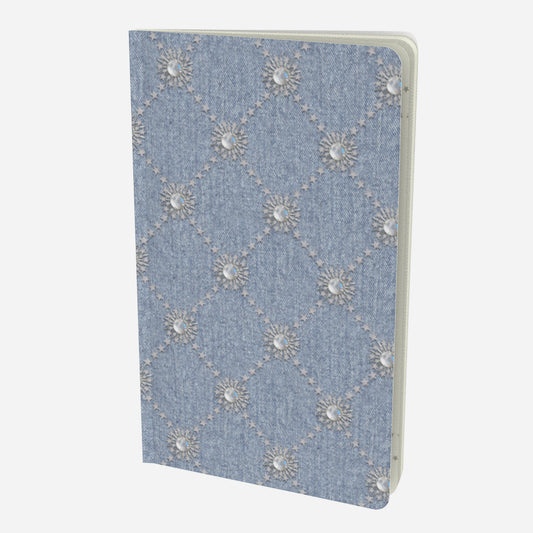 front cover of small notebook with celestial moonstone and stars lattice design on a chambray denim look background