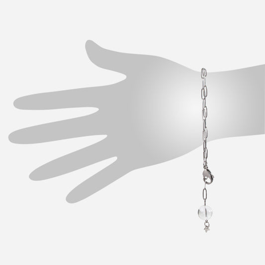 quartz crystal ball with star charm on stainless steel paperclip chain bracelet with oversized lobster claw clasp on hand silhouette