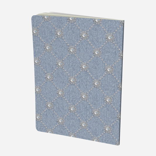 back cover of large notebook with celestial moonstone and stars lattice design on a chambray denim look background