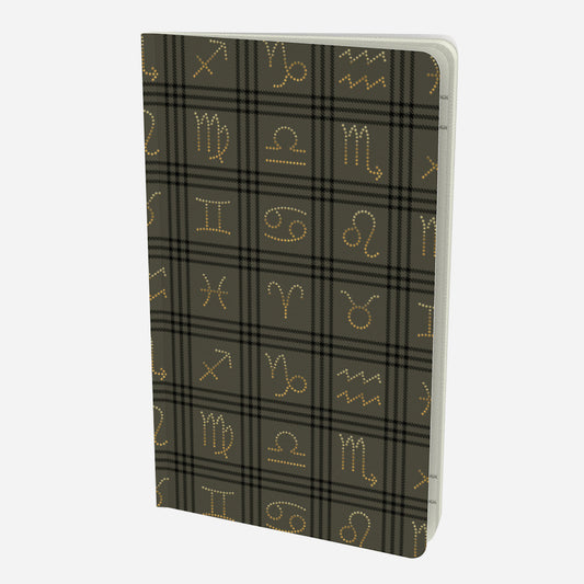 front cover of small notebook with gold zodiac signs on olive and black plaid background